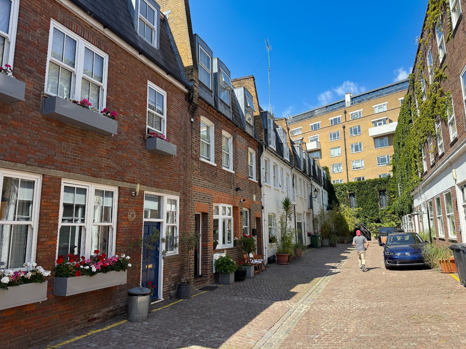 Charming courtyard surrounded by classic London townhouses and modern apartment buildings.