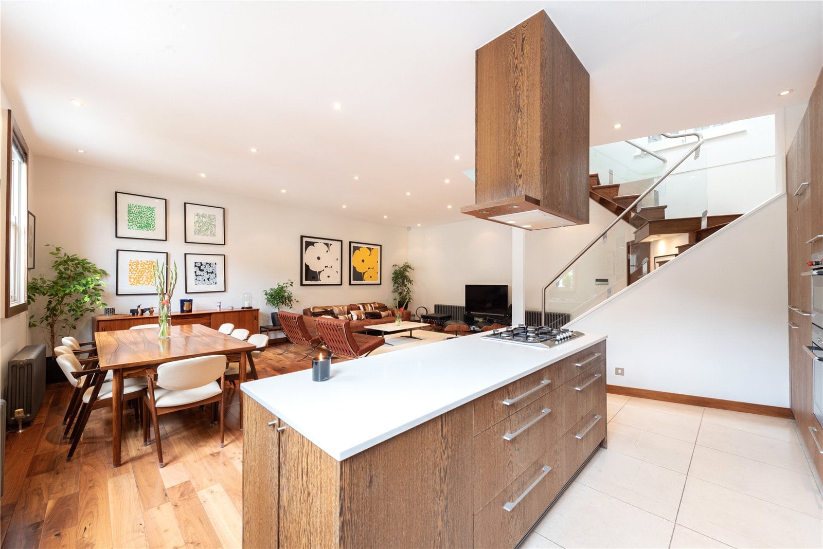 Modern open-plan kitchen and living room with wooden accents, stylish furniture, and contemporary decor - perfect for London property.