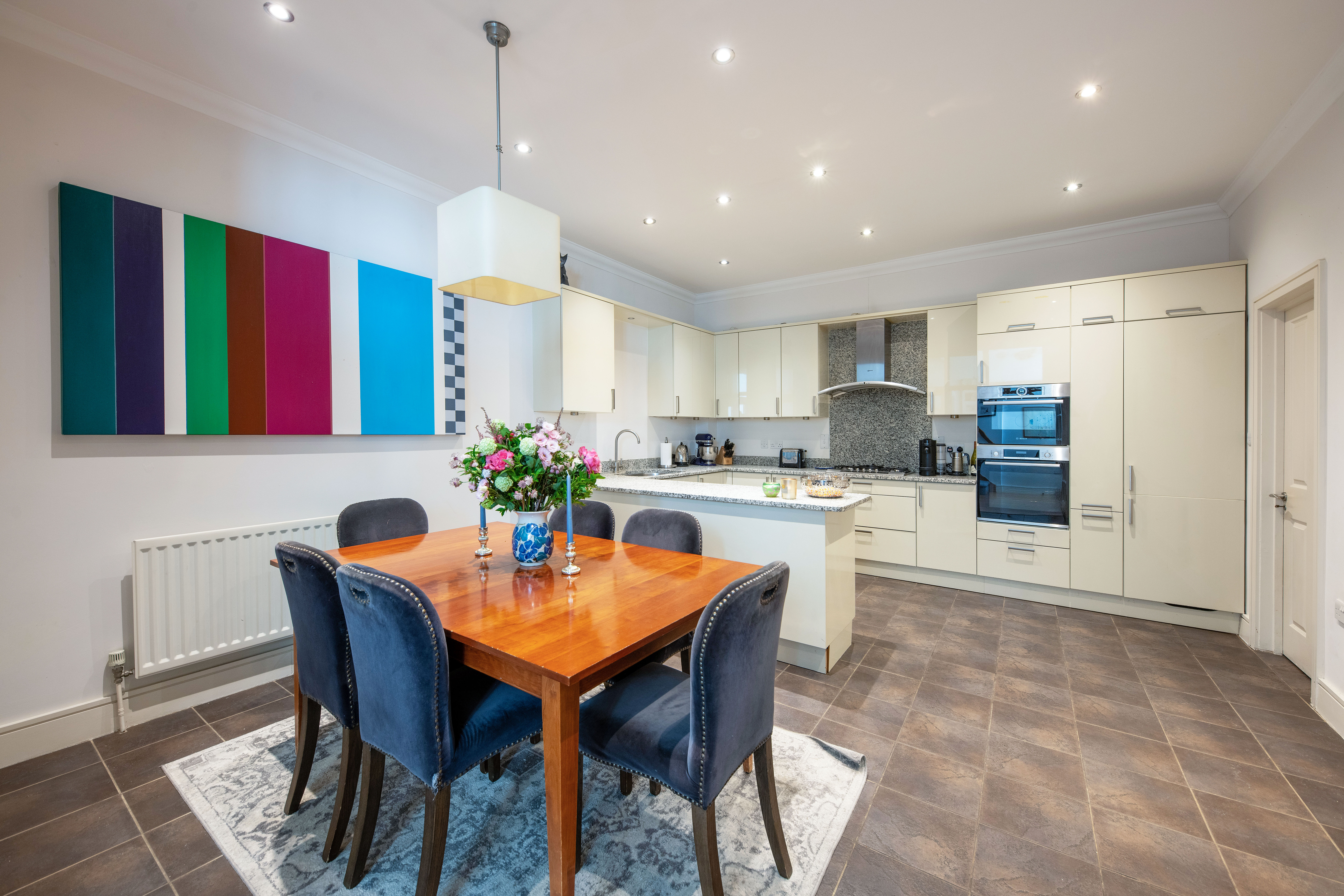 An open plan kitchen and dining space in a London mews house