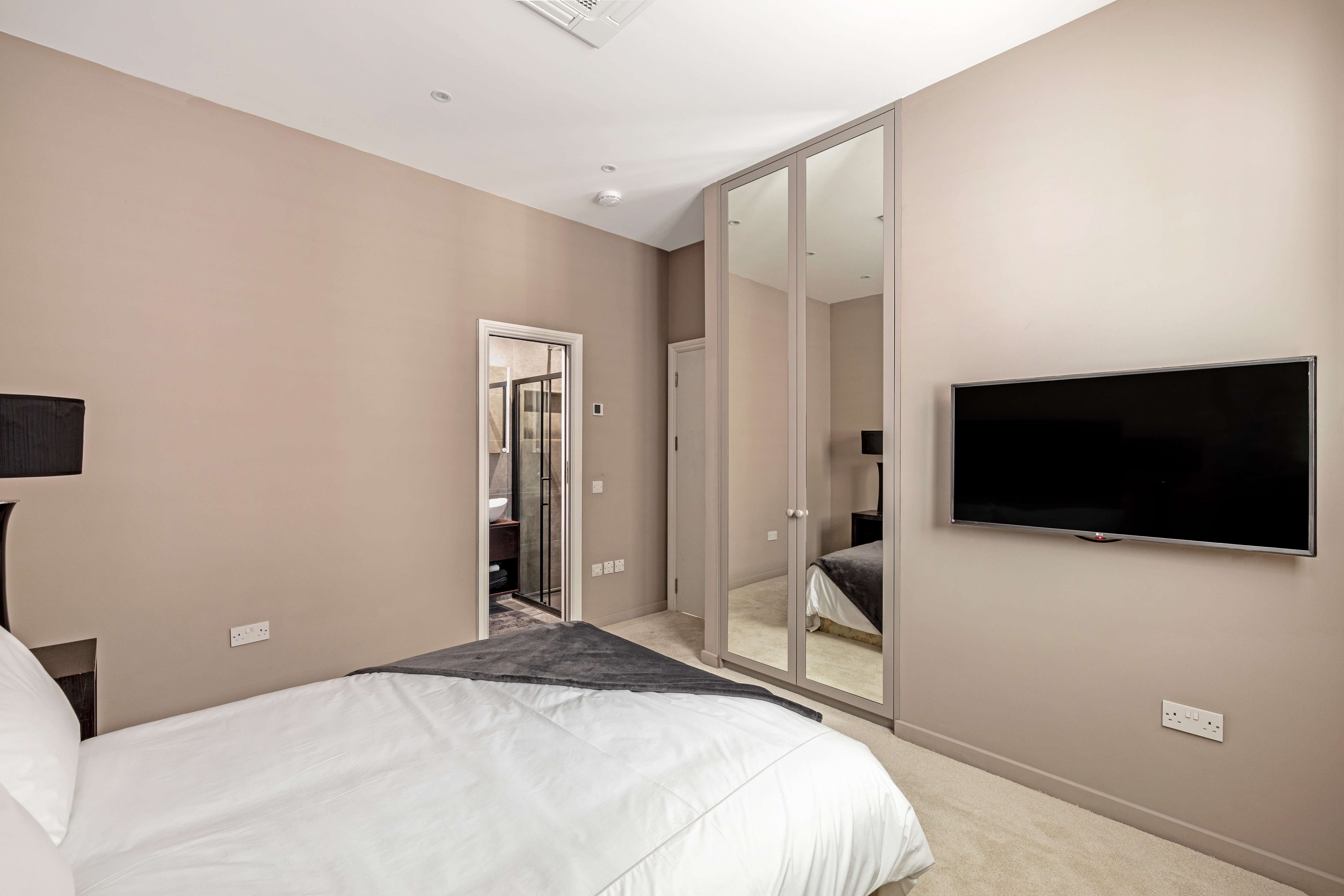 A bedroom with an ensuite