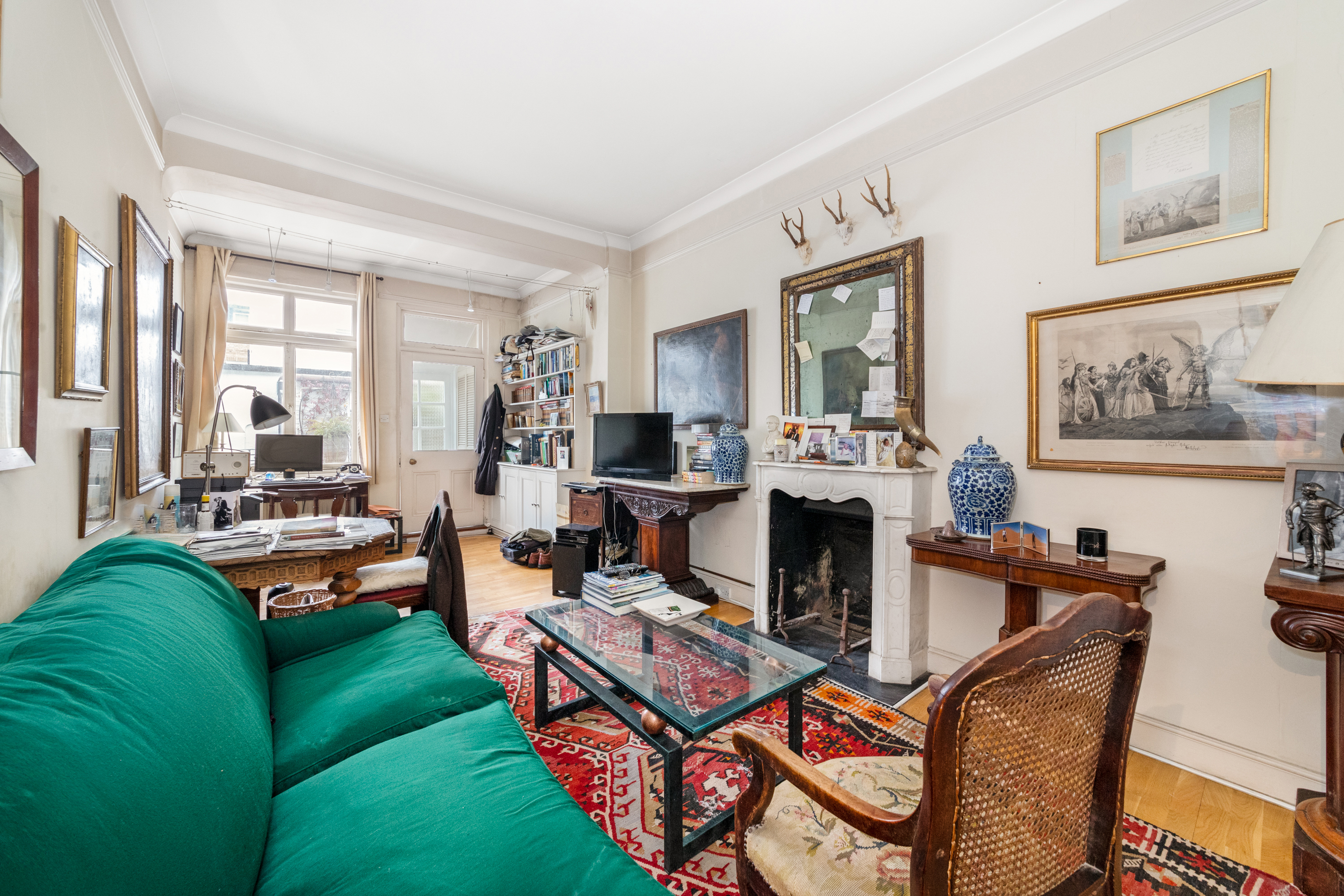 Sitting room with chairs, a sofa and a table