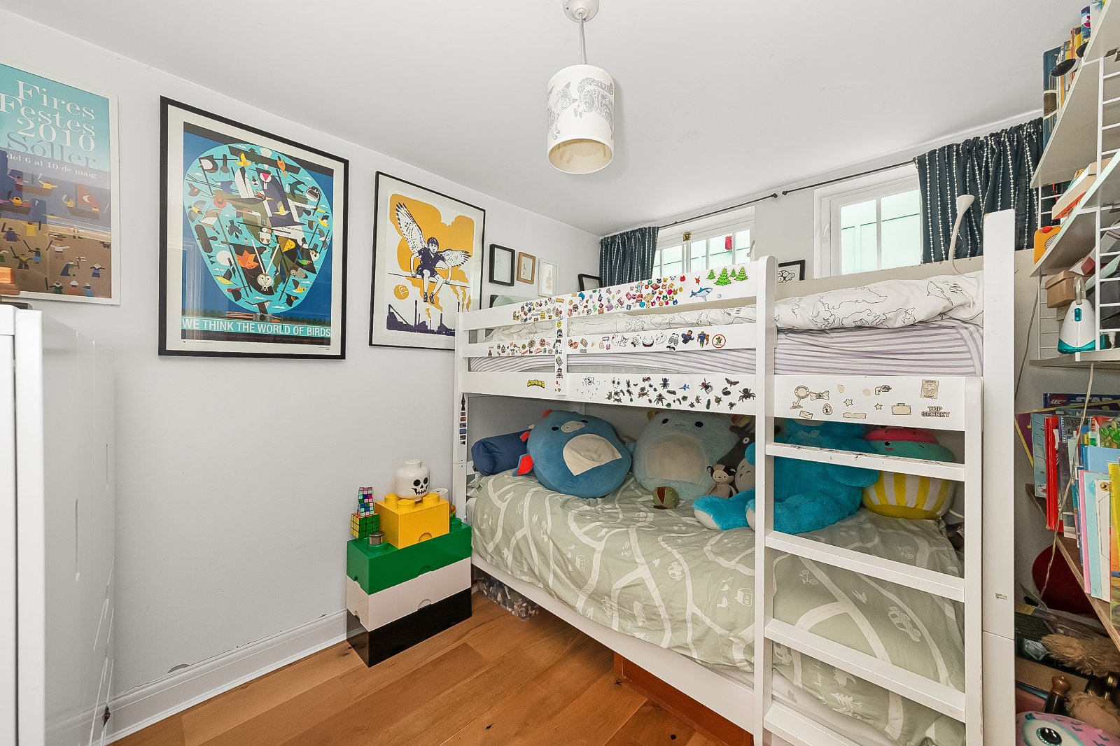 Colourful children's bedroom with bunk beds, stuffed toys, and playful decor at Lurot Brand.