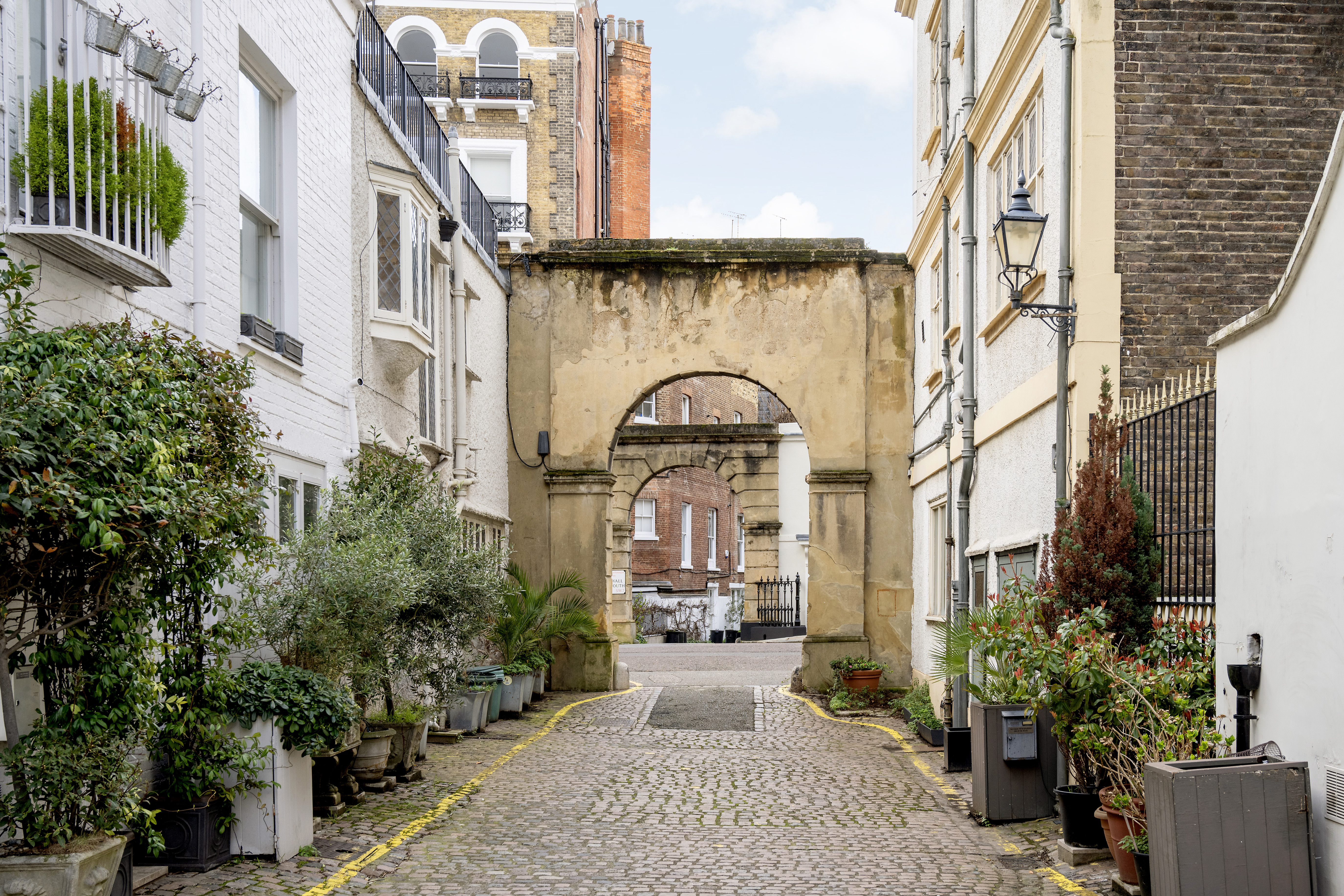 A Mews Street With An Arch Where You Can Rent A Mews House