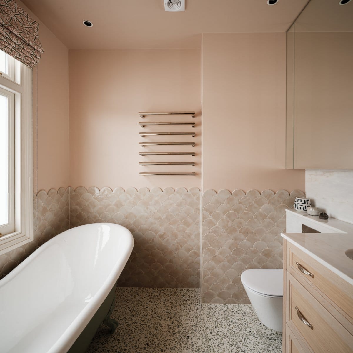 A tiled bathroom in a mews property