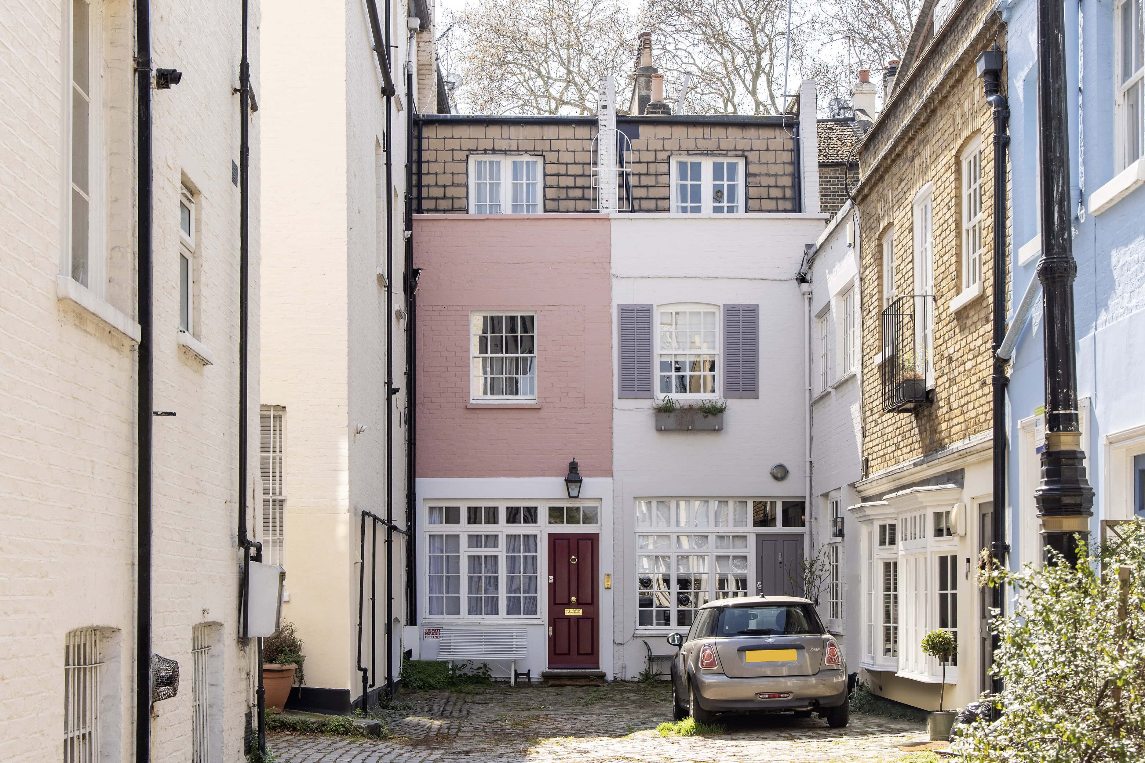 Colourful Terraced Houses In A Historic London Street, Showcasing Charming Architecture And Vibrant Facades.