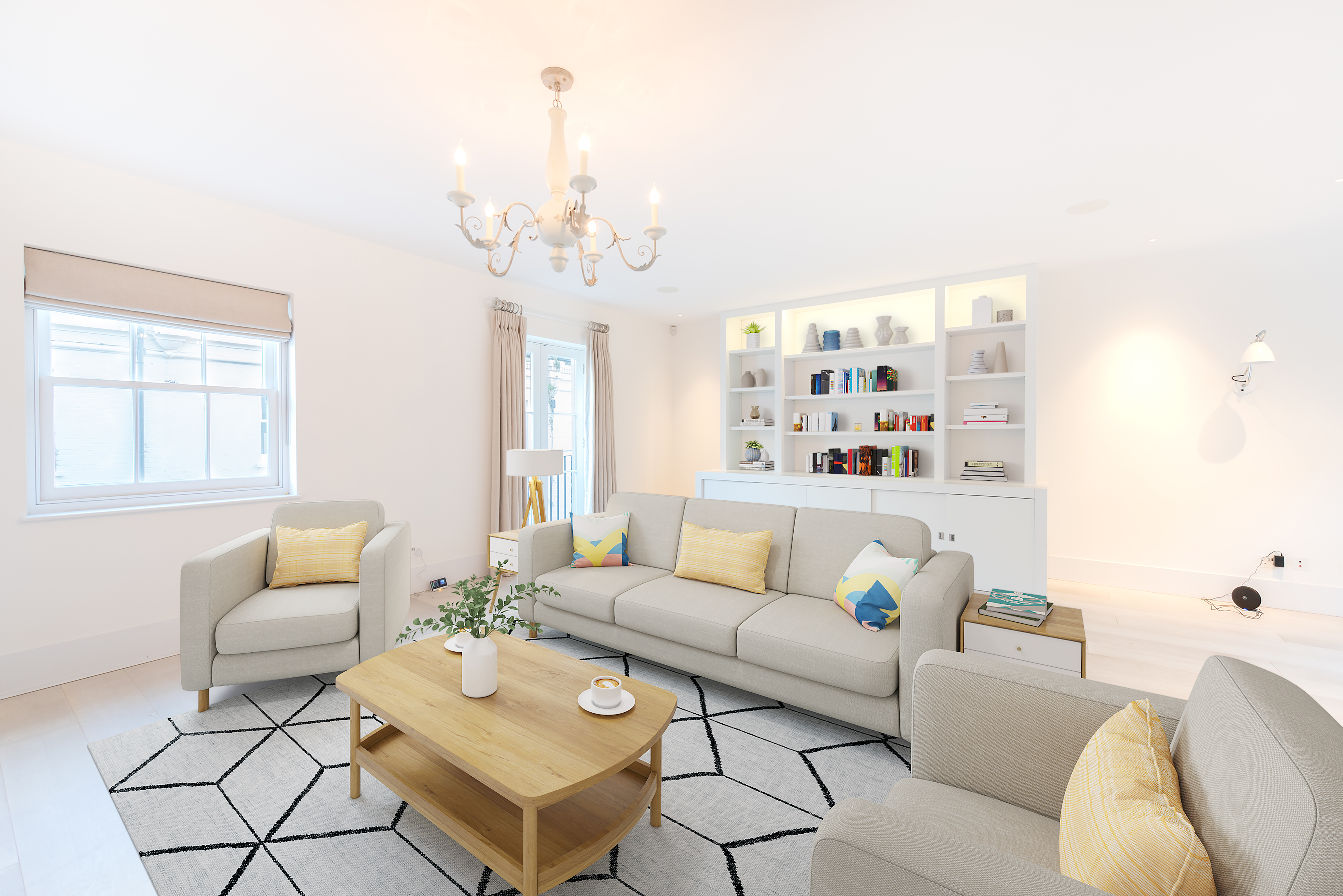 A living room with a three-seater sofa and two single chairs, each with yellow cushions. There is a coffee table with a cappuccino and a white shelving unit behind the sofa