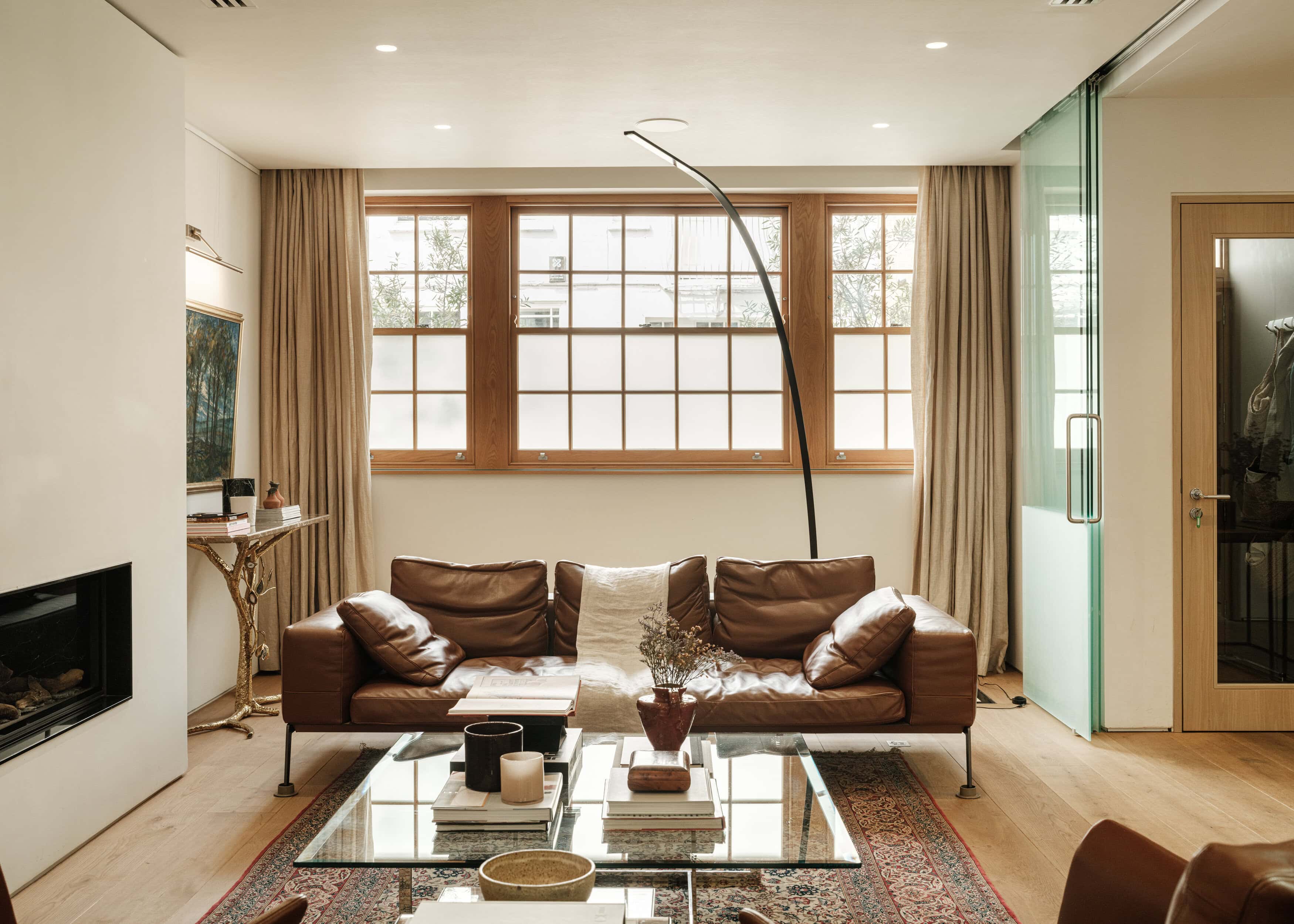 Brown leather sofa in a living room of a mews house