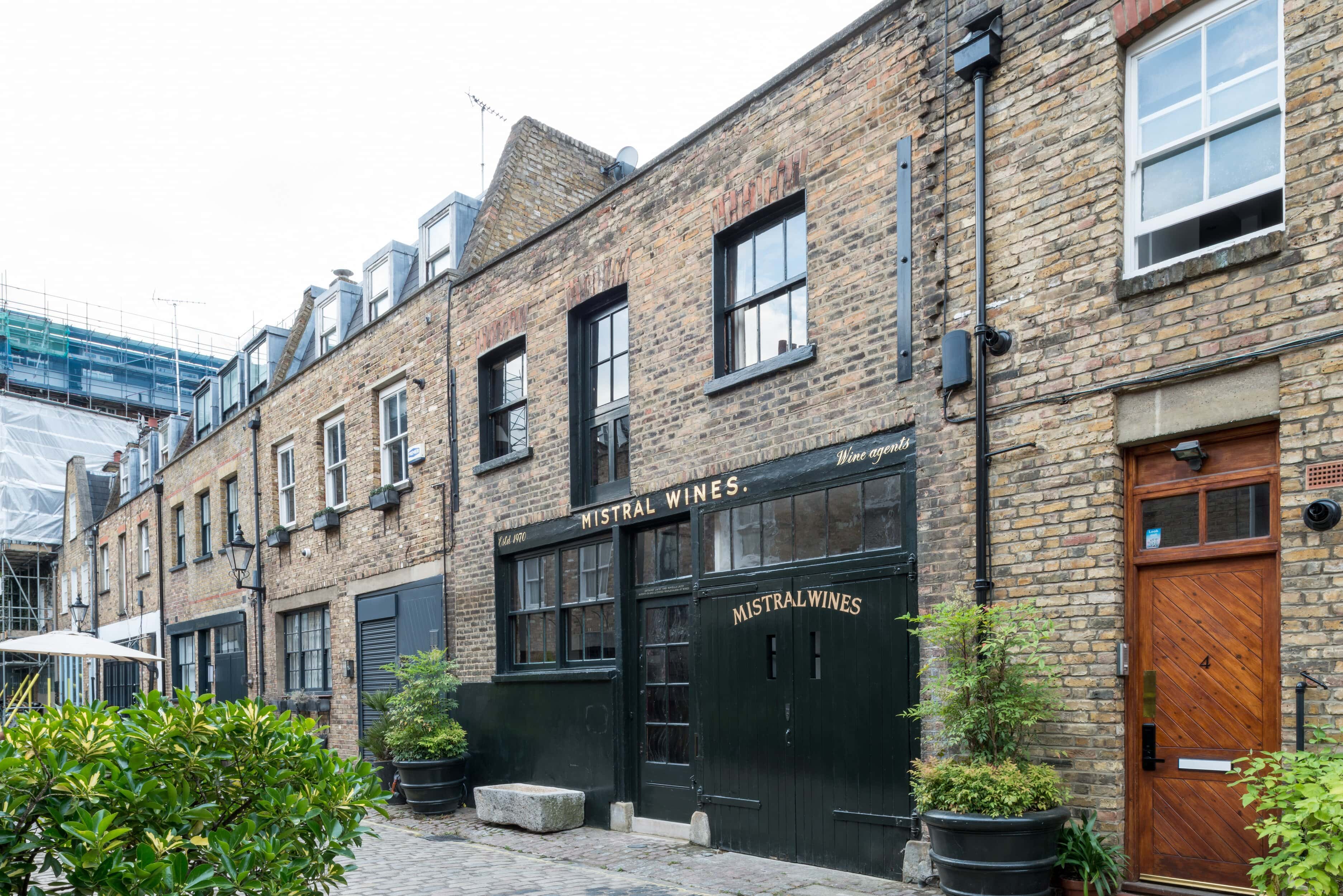 A building with stables in a mews street in London