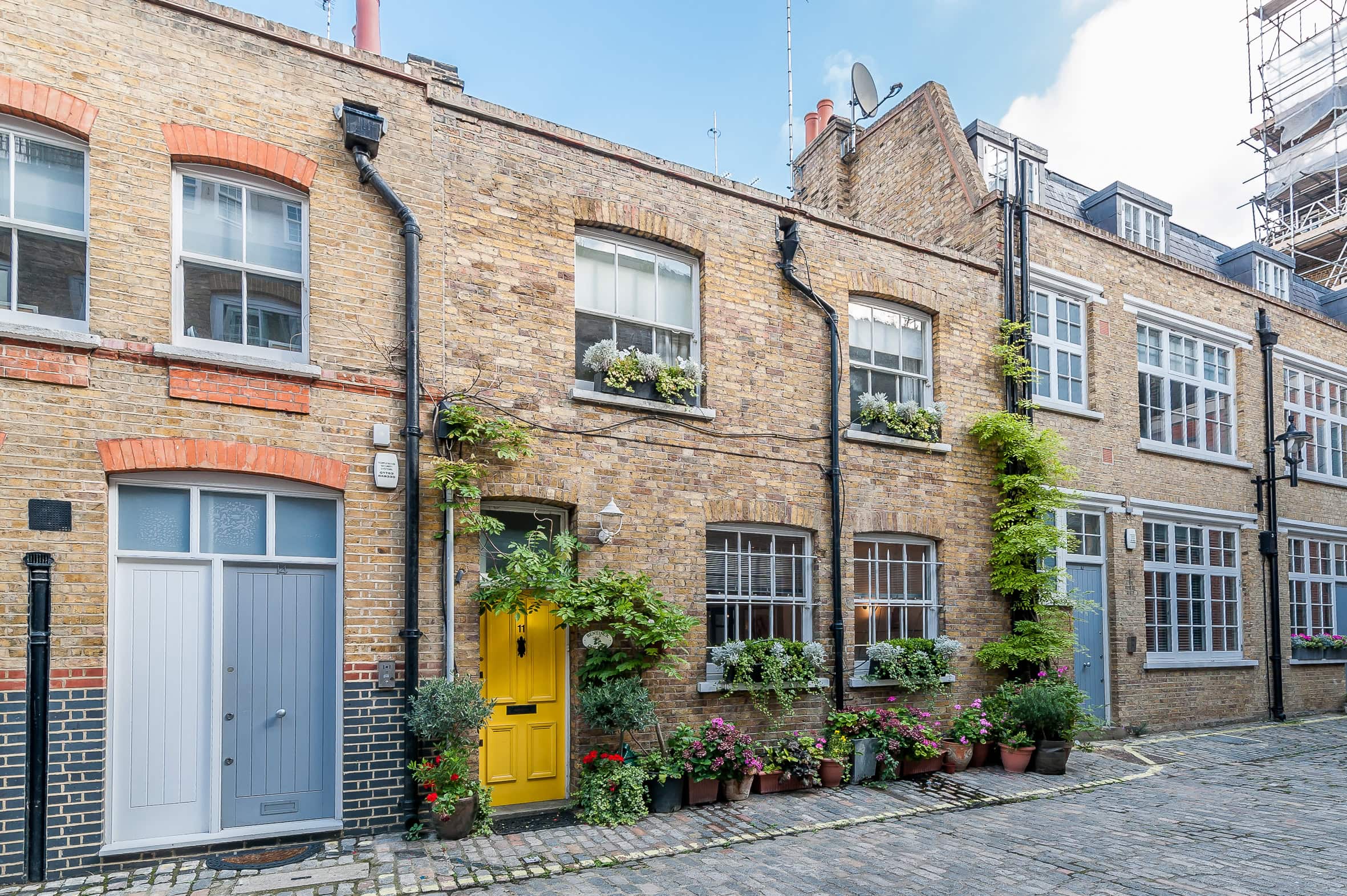 A mews house with a yellow door