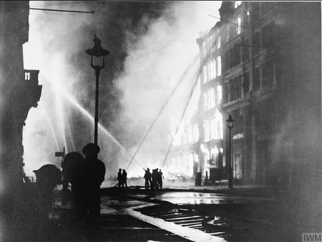 Firefighters tackling a fire during the London blitz