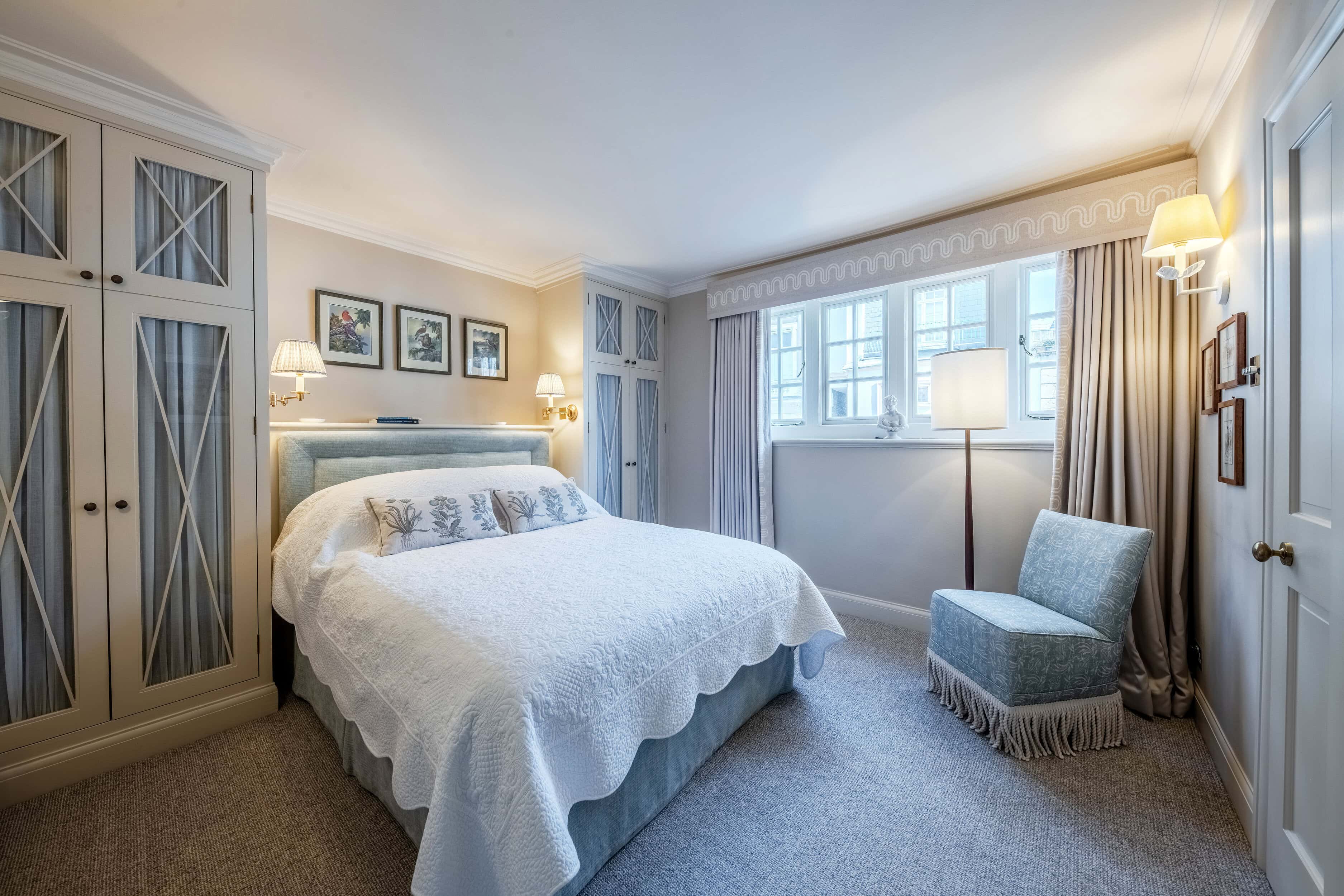 A bedroom with a double bed in a mews property in London