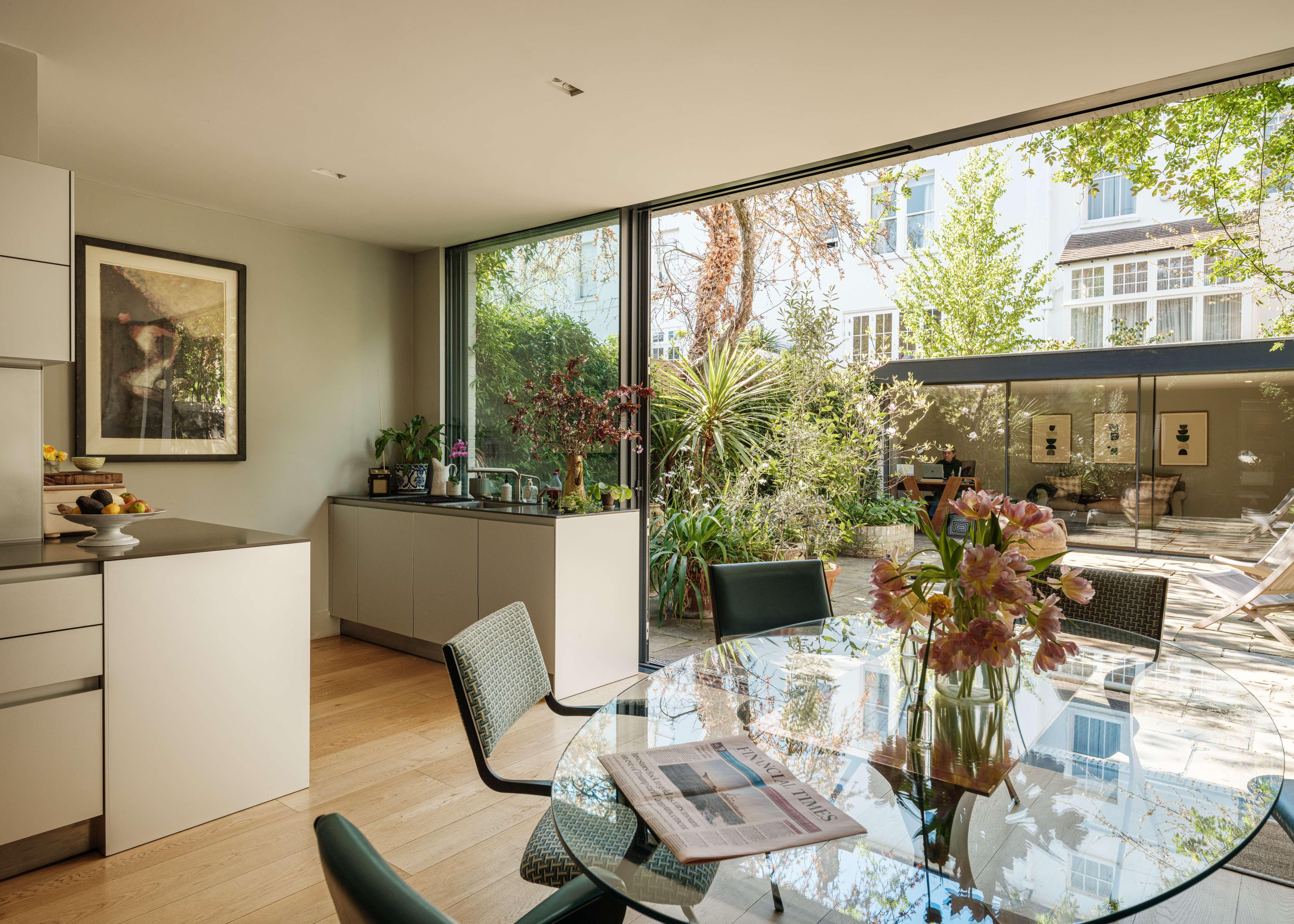 An open-plan kitchen with dining table