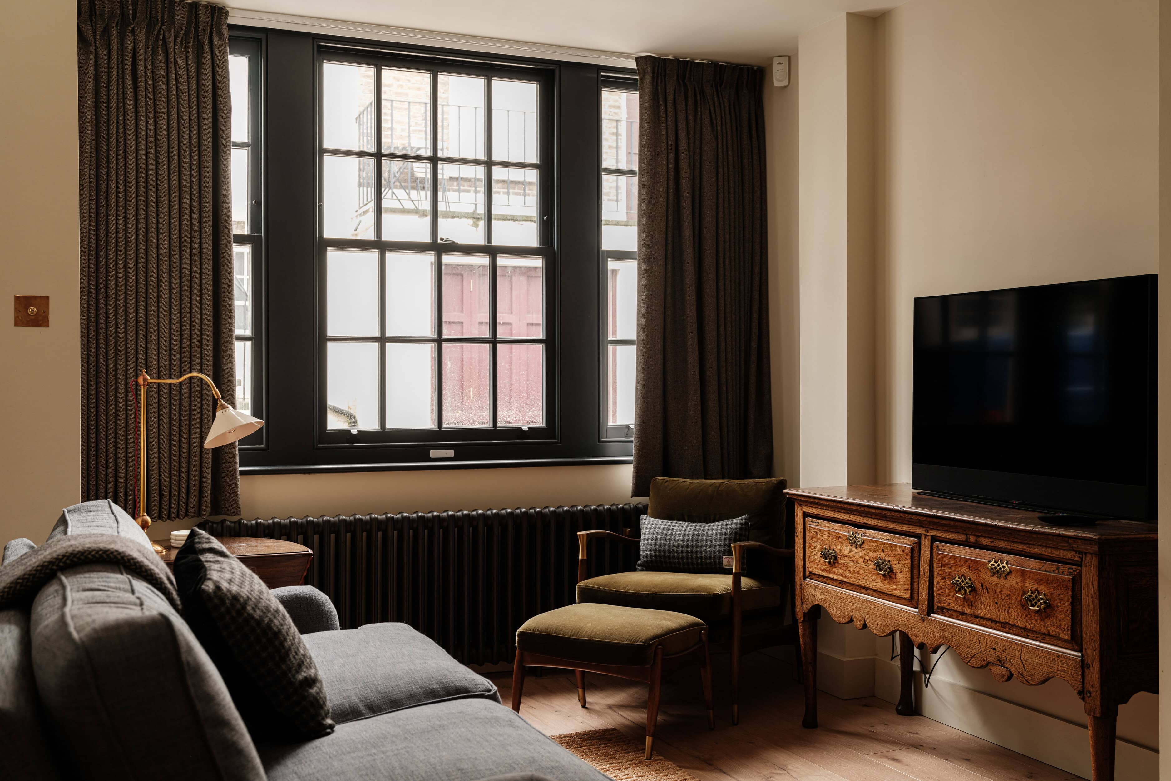 A living room with sofa and windows