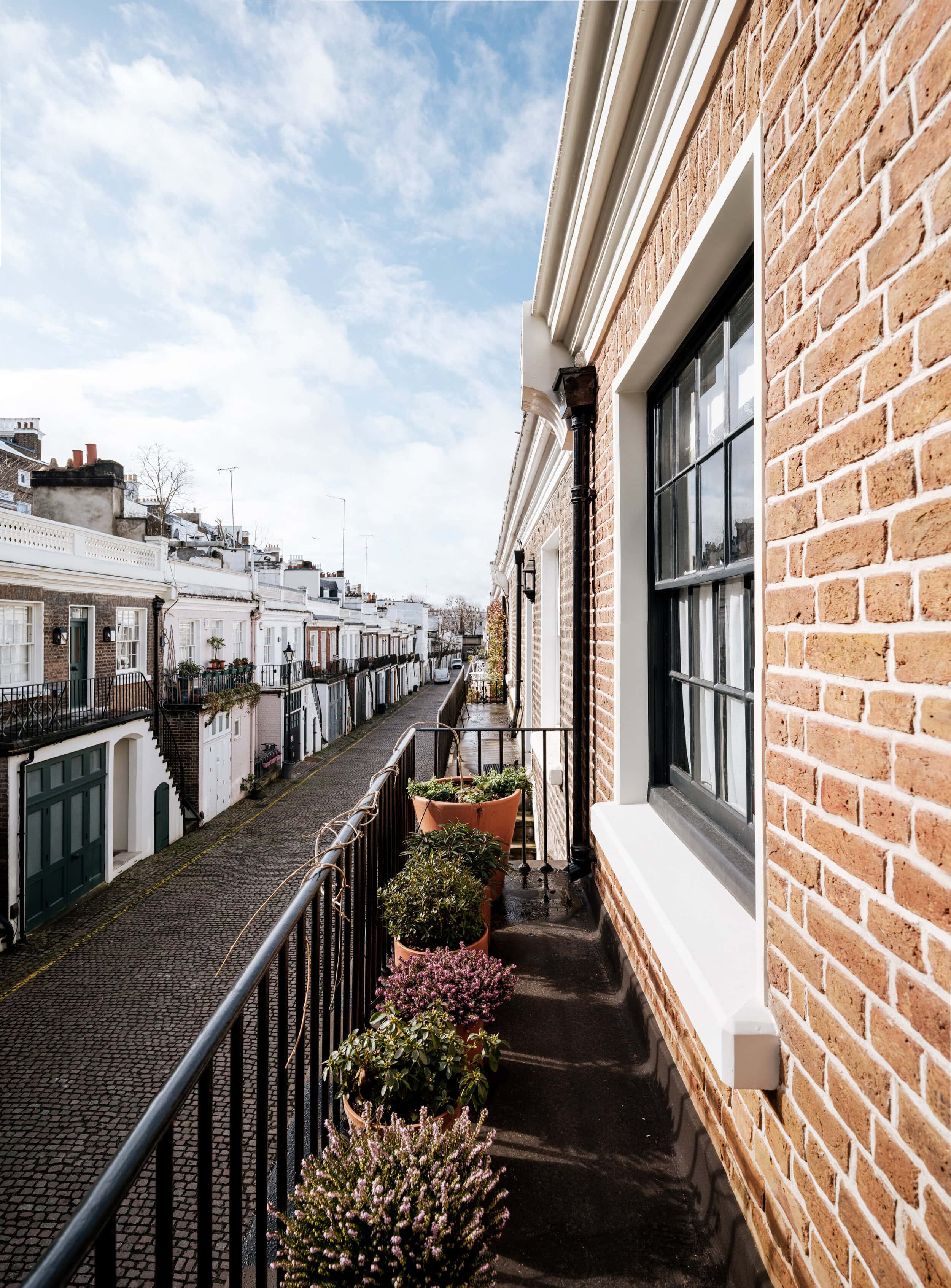 A balcony overlooking the mews street