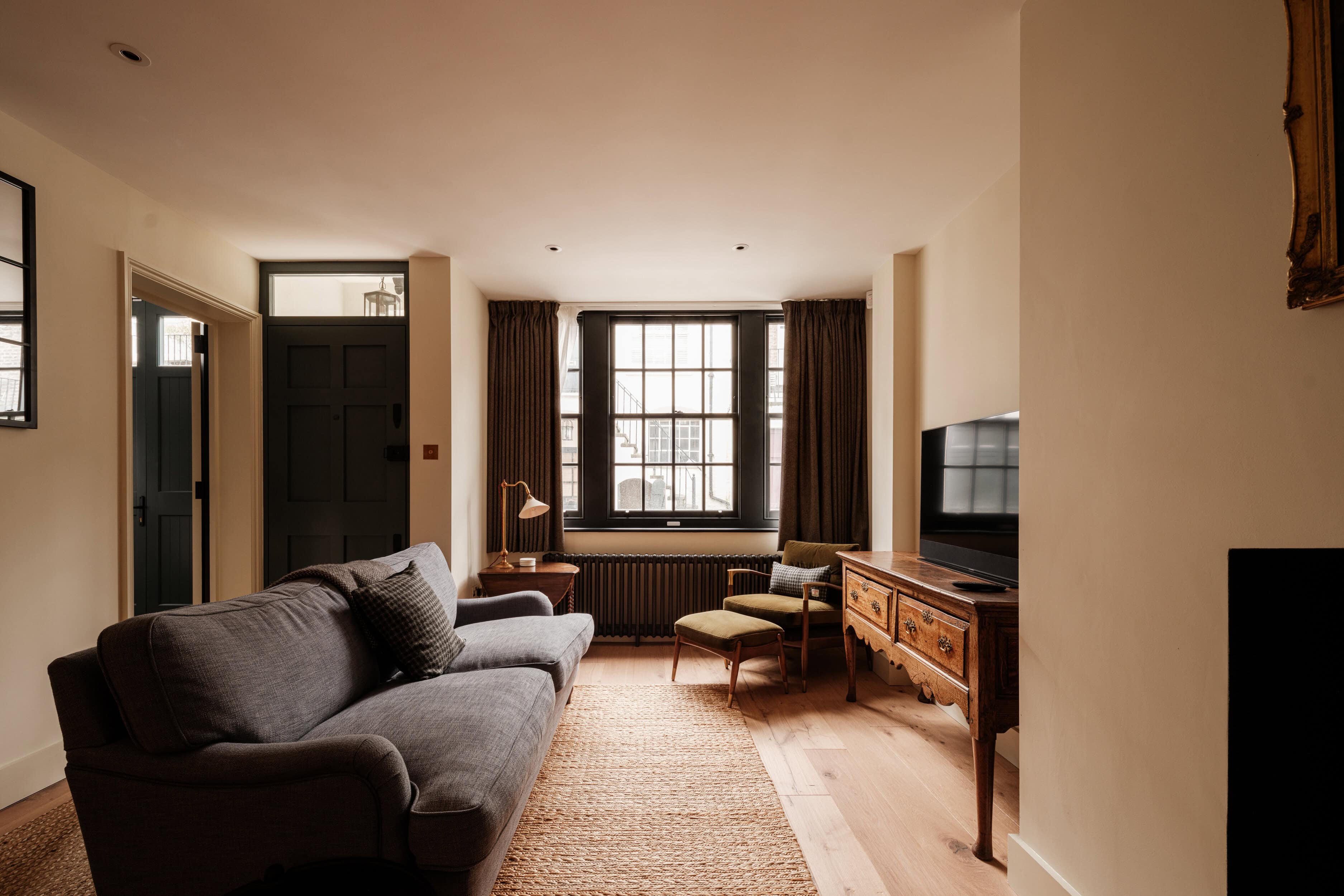 A modern living room with a navy sofa