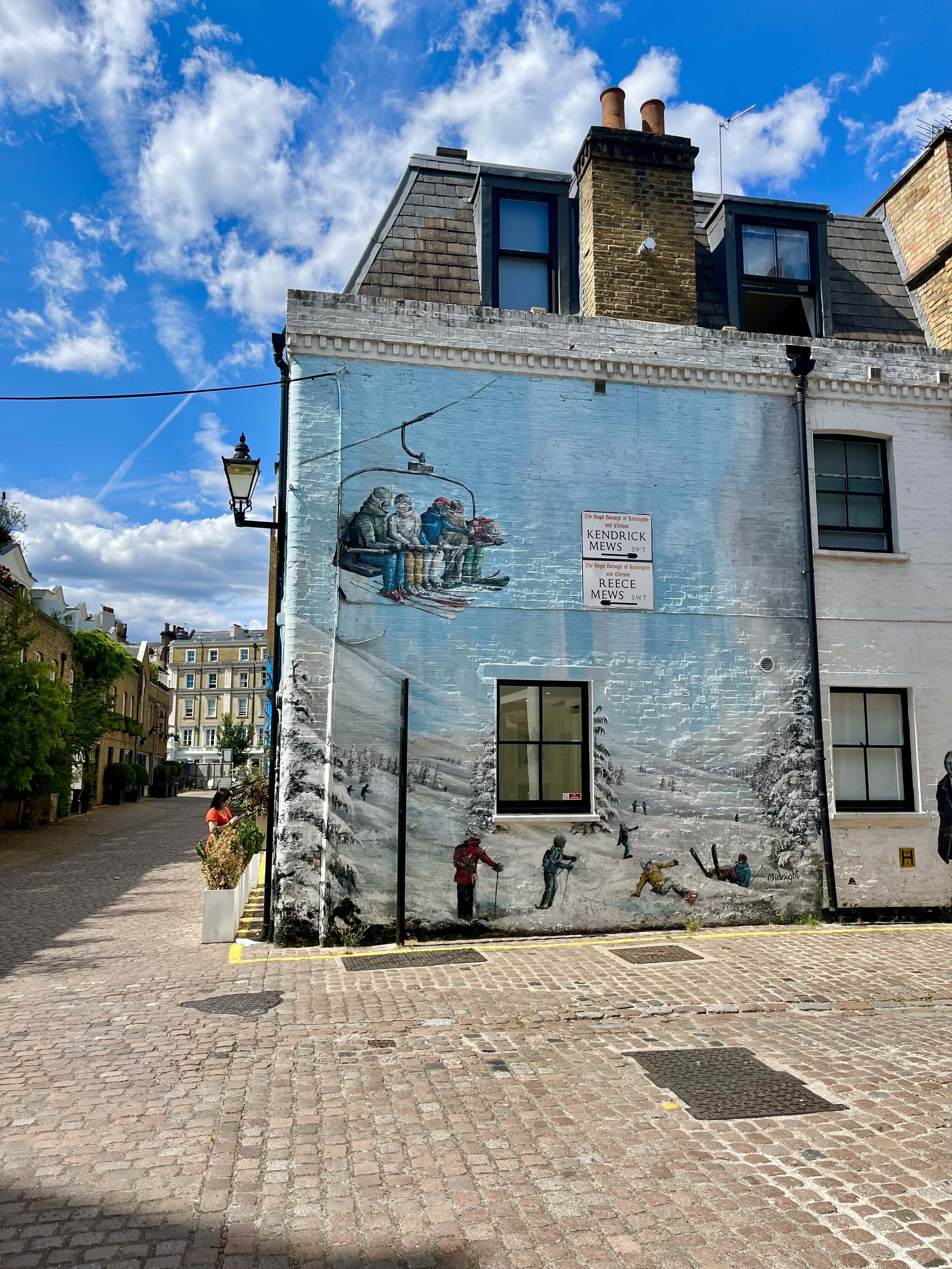 A mews street with an art mural