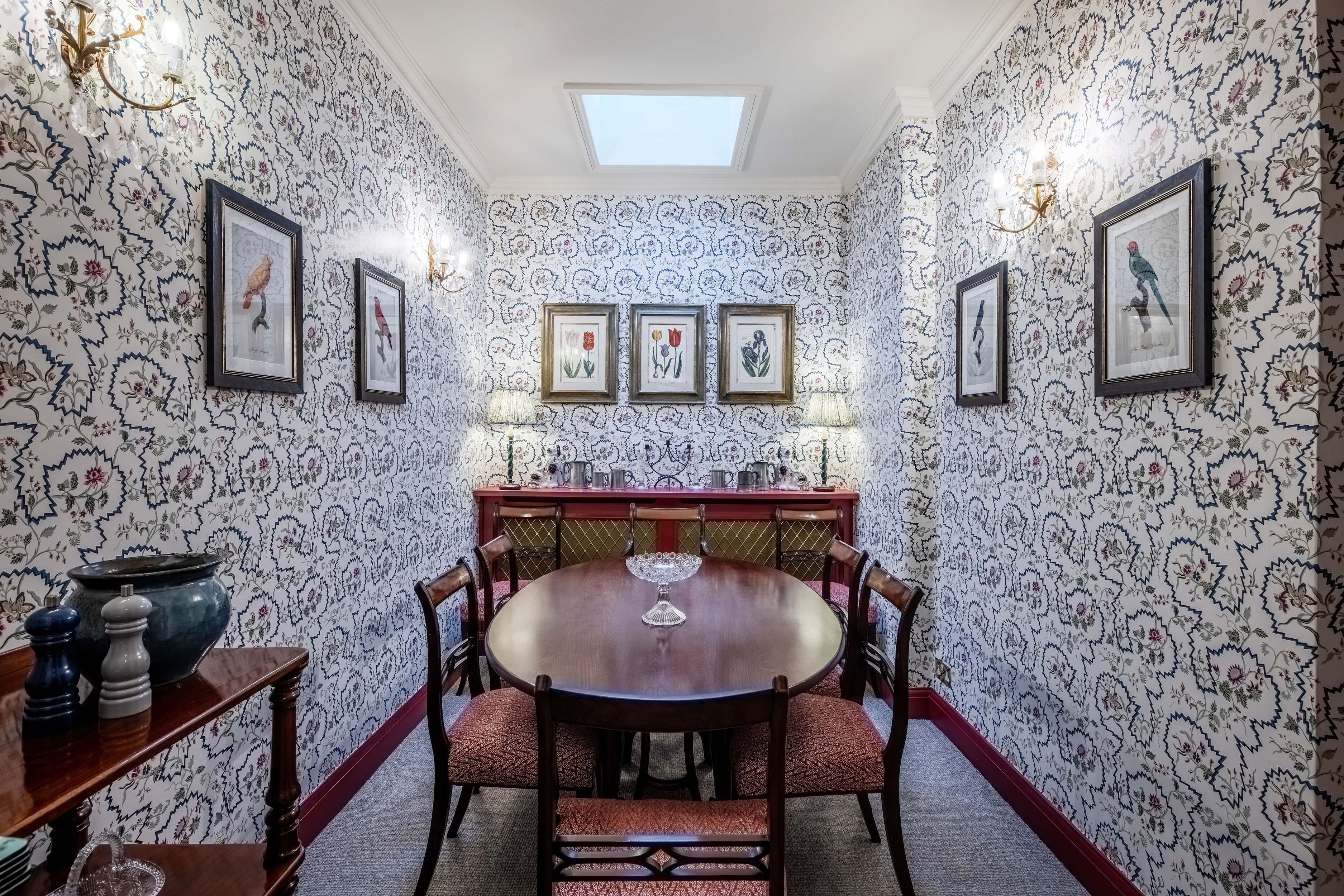 A whimsical living room inside the charming mews home for rent on Cornwall Mews South.