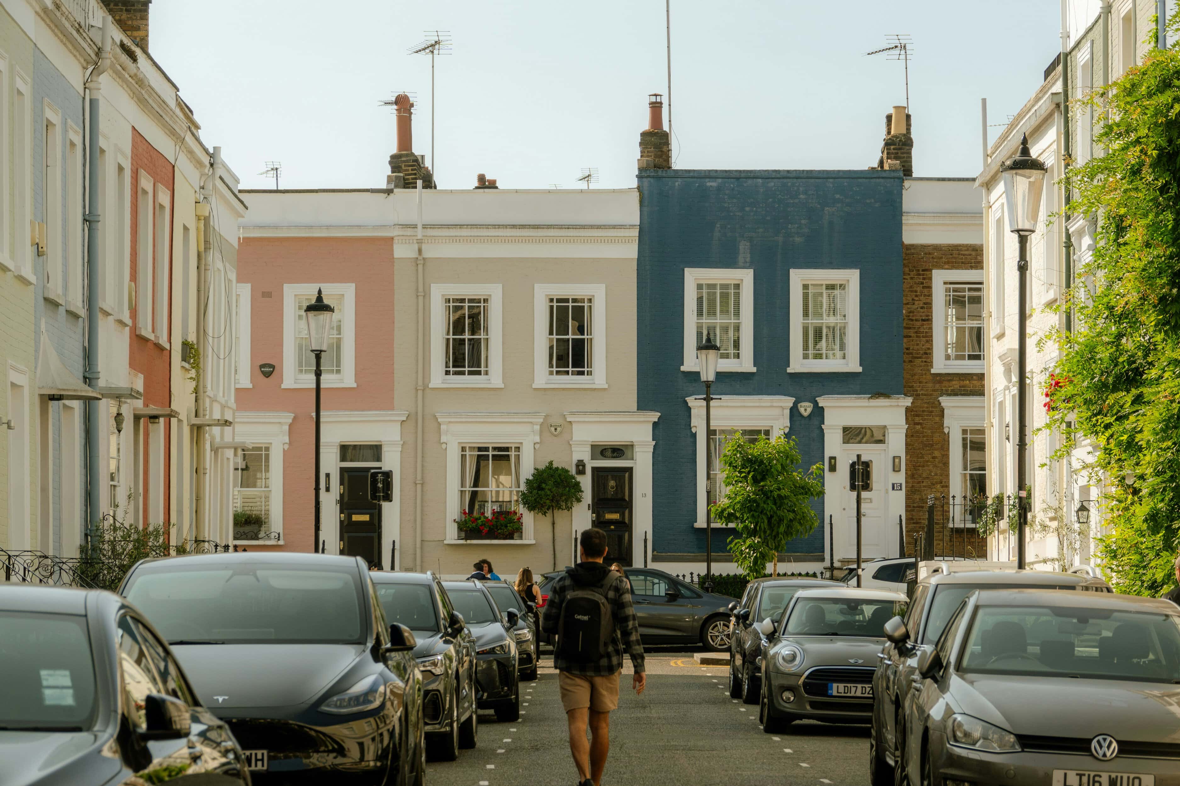 A man walking on a road looking to rent in Notting Hill