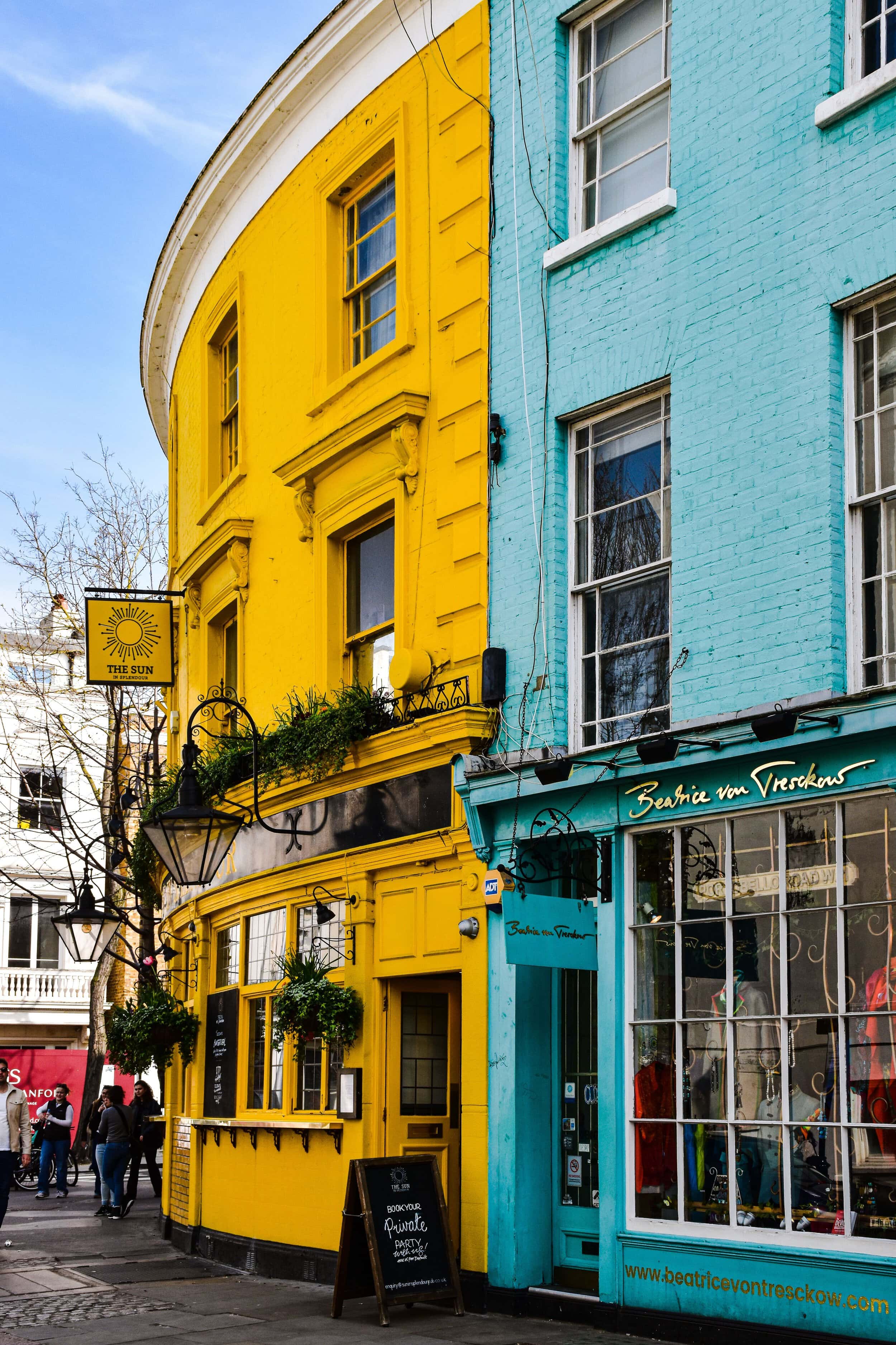 Vibrant yellow and blue buildings in Notting Hill, London to enjoy for those who rent in Notting Hill