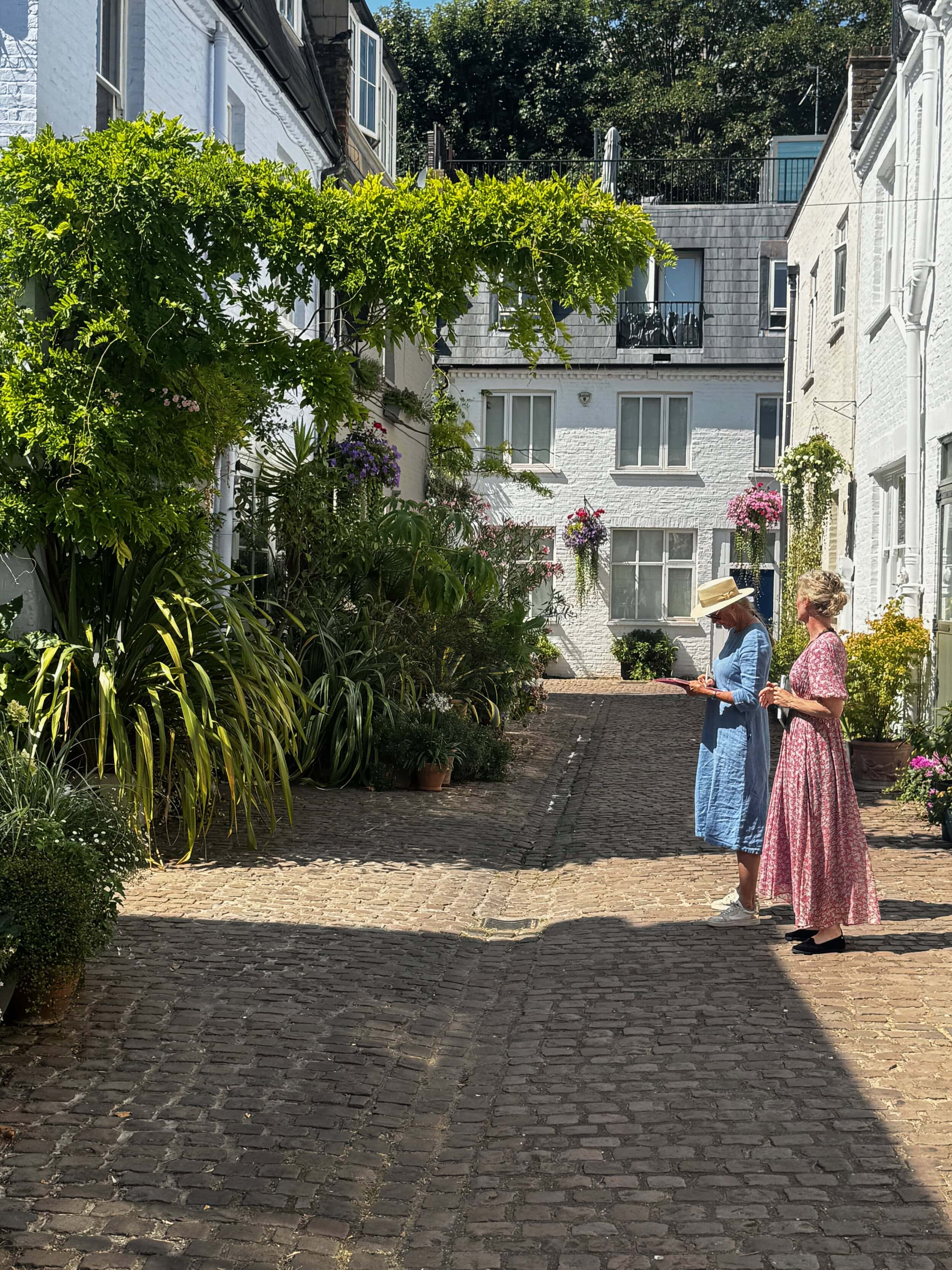 Alexandra Gray and Peggy Lurot looking at the mews streets for our Mews in Bloom competition