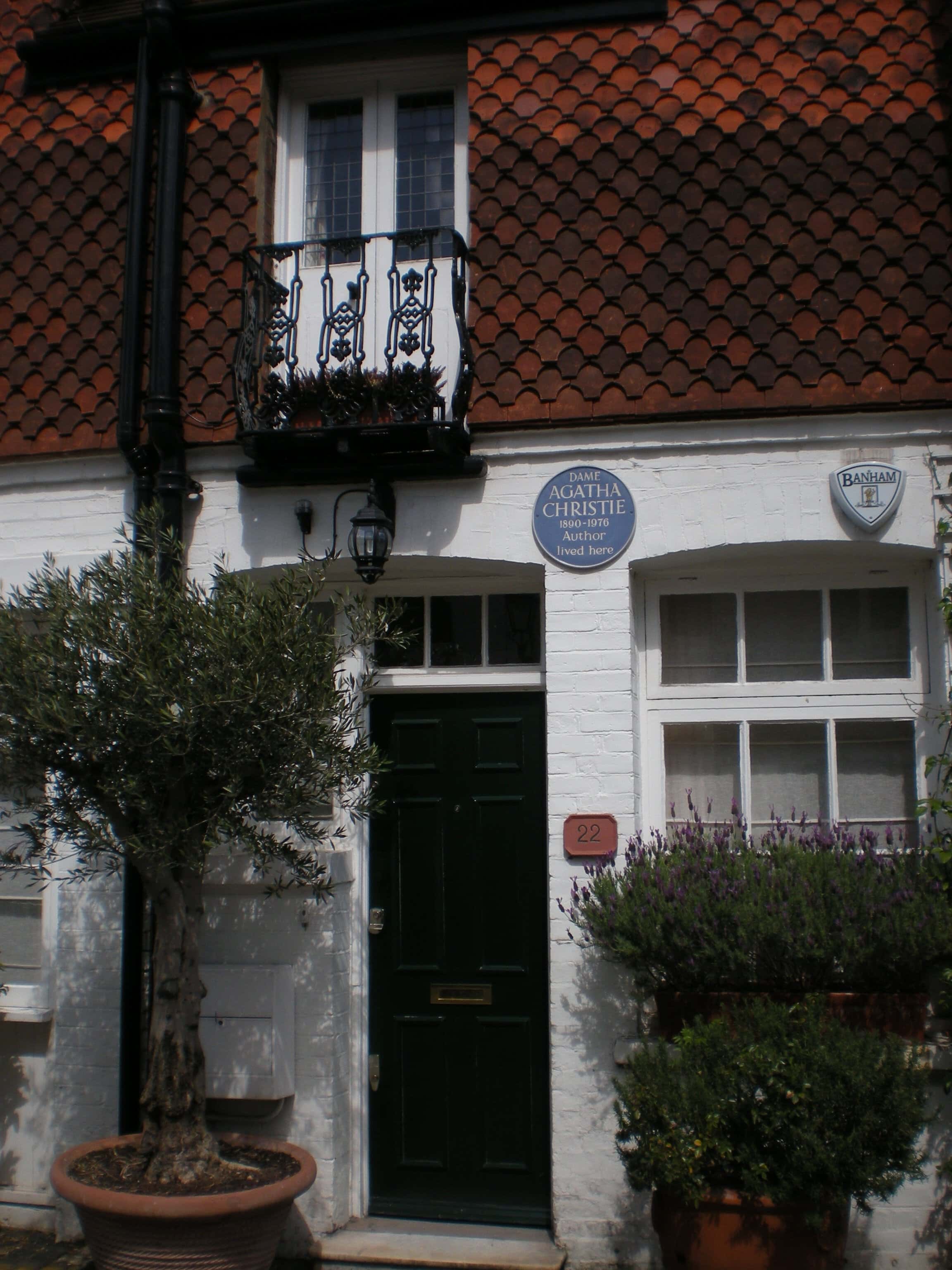 Historic London mews house with commemorative plaques and traditional architecture.