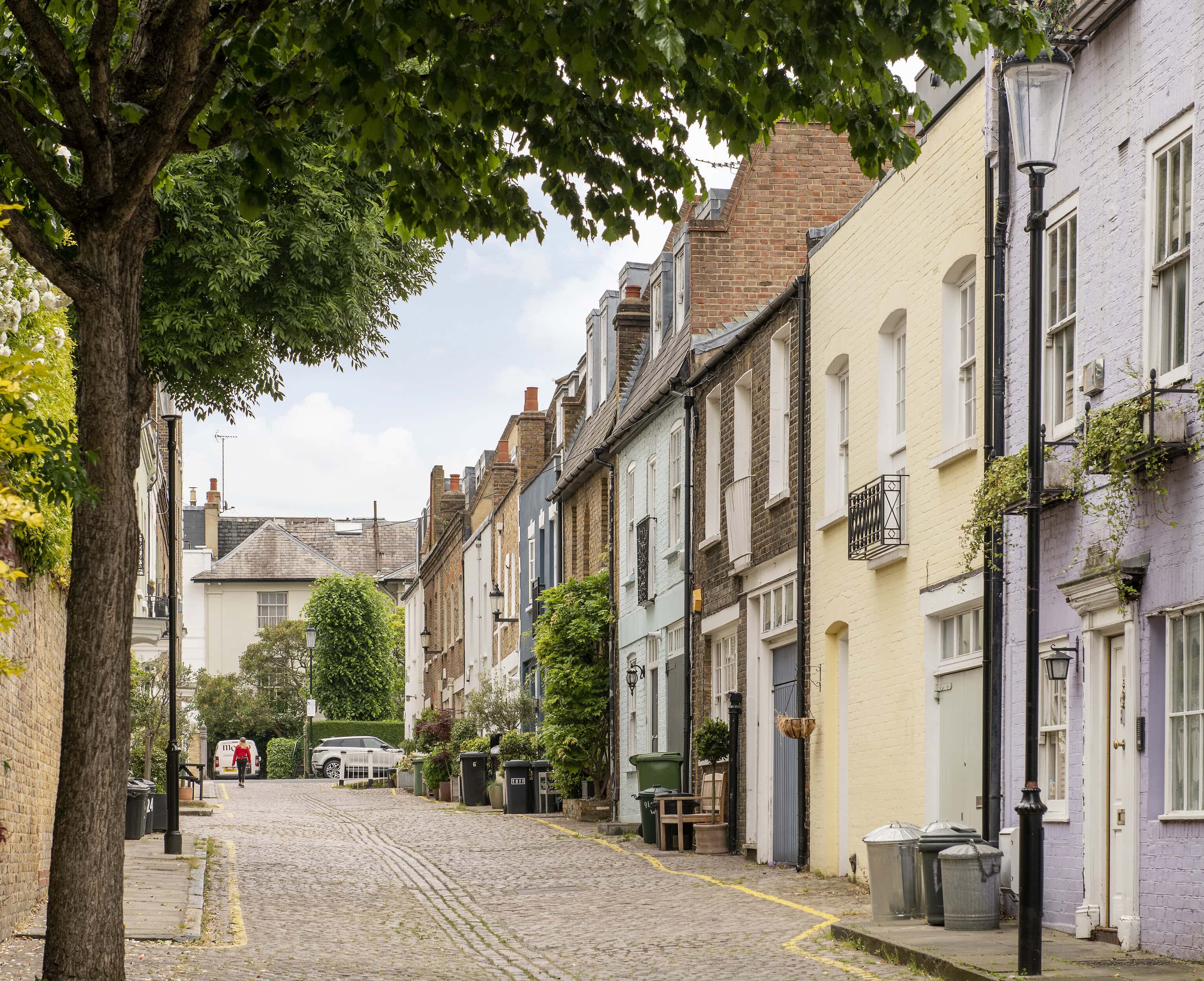 Colourful row of historic mews houses in Notting Hill, London.